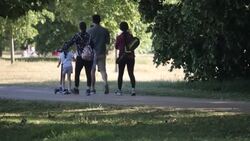 People sunbathing and London traffic News Clip