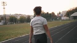 Mixed race man athlete warming up doing jumping jacks before running or work out Stock Footage
