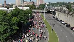 RUNNING RACE - DRONE SHOT - CAMERA MOVES WITH RUNNERS HEADING TO CAMERA Stock Footage