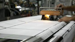 Technician is doing maintenance and repair of weaving loom machines in textile factory Stock Footage