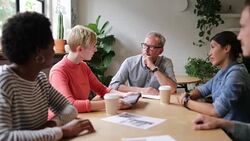 Young adult giving a presentation in a business meeting Stock Footage