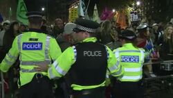 Police hold back Extinction Rebellion protesters in Whitehall News Clip