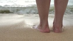 Foot of Tourist Standing on a Beach Stock Footage