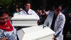 CLEAN : Salvadorans receive remains of relatives killed during civil war News Clip