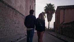 Happy couple on vacations. Old town panorama in background Stock Footage