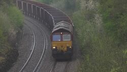 Freight train carries what appears to be coking coal from Immingham to Scunthorpe News Clip
