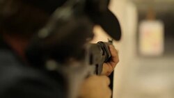 Slow motion target shooting on a firing range News Clip