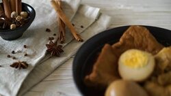 hard-boiled egg in brown sauce or sweet gravy sauce Stock Footage