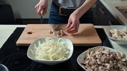 Woman cutting chicken meat Stock Footage