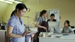 Asian Seamstress Using Tablet Computer Stock Footage