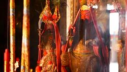Buddhist traditional statues of chinese sacred gods on the altar inside the temple Stock Footage