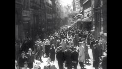 People Walk Along Street as Hitler Makes Plans for Invasion Stock Footage