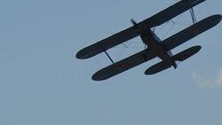 Ancient Russian aircraft biplane An2 flying in the blue sky Stock Footage