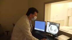 Anonymous COVID patient having a tomography scan News Clip