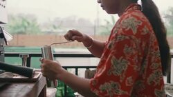 Young woman using coffee grinder at home. Stock Footage