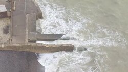 Ocean, sewage pipe and coastline aerials in Seaford News Clip