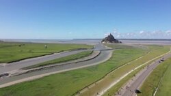 CLEAN : Aerial shots of French tightrope walker crossing bay of Mont Saint-Michel News Clip