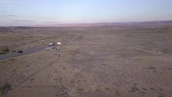 Aerial Drone Footage of Semi-Trucks Rolling Down the Highway Stock Footage