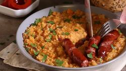 Eating entils stew with fried pork sausages Stock Footage