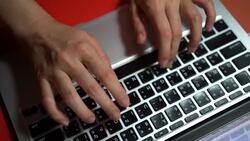 4k women's hands type a laptop on the keyboard Stock Footage