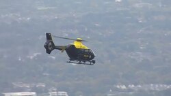 Aerial views of Police helicopter flying over Extinction Rebellion protests News Clip