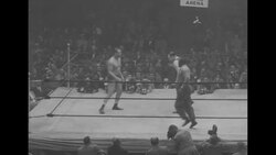 Boxing champion Joe Louis takes up wrestling against wrestler Cowboy Rocky Lee in match in Washington, DC News Clip