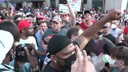 Pro Trump & Anti Trump Protesters cross paths outside Rally News Clip