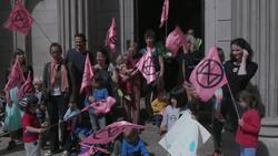 Extinction Rebellion families hold a protest outside the Bank of England News Clip