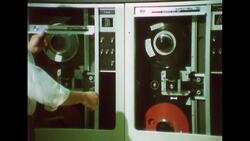 UNITED STATES 1960s: Close up of woman / Hands hold plastic over text. Stock Footage