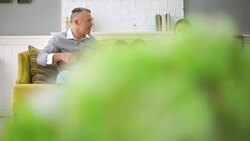 Family Talk And Relax On Sofa Stock Footage