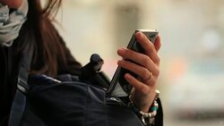 Close-up of commuter hands holding smartphone device while riding train to work Stock Footage