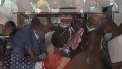 CLEAN : Large crowd outside room where Guinea's junta holds talks with political parties News Clip