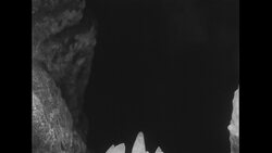 United States, c.1951: A geologist uses a flashlight to observe the different formations in the White Grotto in Italy Stock Footage