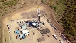 Aerial View of a Fracking Drilling Rig in the Autumn Mountains of Colorado Stock Footage