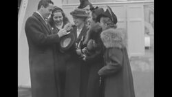Actress Mary Pickford and her fiance actor and bandleader Buddy Rogers on board ship in US set to sail for London News Clip