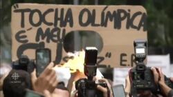 Riot police protect torchbearers in Rio News Clip