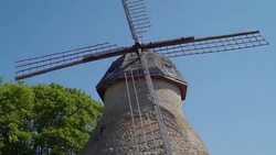 The old vintage windmill in Lahemaa park in Estonia Stock Footage