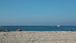 Tourists tanning on beach in Cassis a Mediterranean fishing port in Southern France Stock Footage