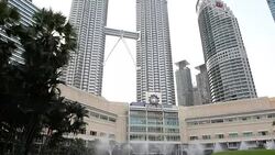 Petronas twin towers twin buildings in Kuala Lumpur Stock Footage