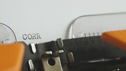 Close up footage of a person writing CORRUPTION on an old typewriter, with sound Stock Footage