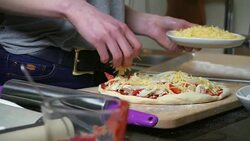 Young woman preparing pizza Stock Footage