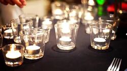 Restaurant staff setting candlelight on table for dinner party or wedding reception. Stock Footage