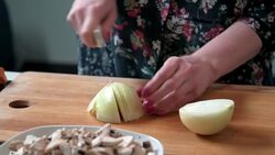 Woman cutting onion Stock Footage