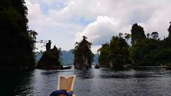 Moving follow boat with Beautiful mountains lake river sky and natural attractions in Ratchaprapha Dam at Khao Sok National Park, Surat Thani Province, Thailand. Stock Footage