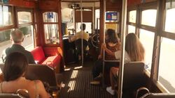 Lisbon tram driving through streets News Clip