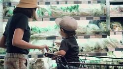 Asian mother and child shopping for groceries. Stock Footage
