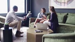 Business people discussing in office lobby Stock Footage