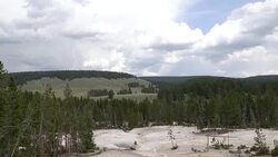 tilt down wide shot of sulphur caldron in yellowstone Stock Footage