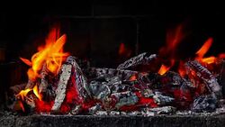 Close up front view of fire burning in a brick barbecue. Stock Footage
