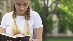 Shy boy giving flowers to girl, trying to ask for date, refusal and insecurities Stock Footage